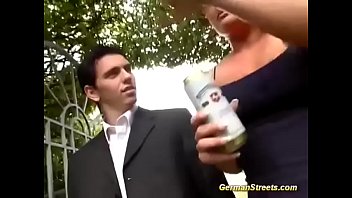 Voluptuous redhead and her accomplice in an outdoor threesome