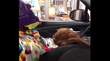 Clown gives himself a blowjob in a fast food restaurant